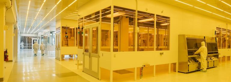 The MIT.nano clean room, with amber light to facilitate UV engraving.